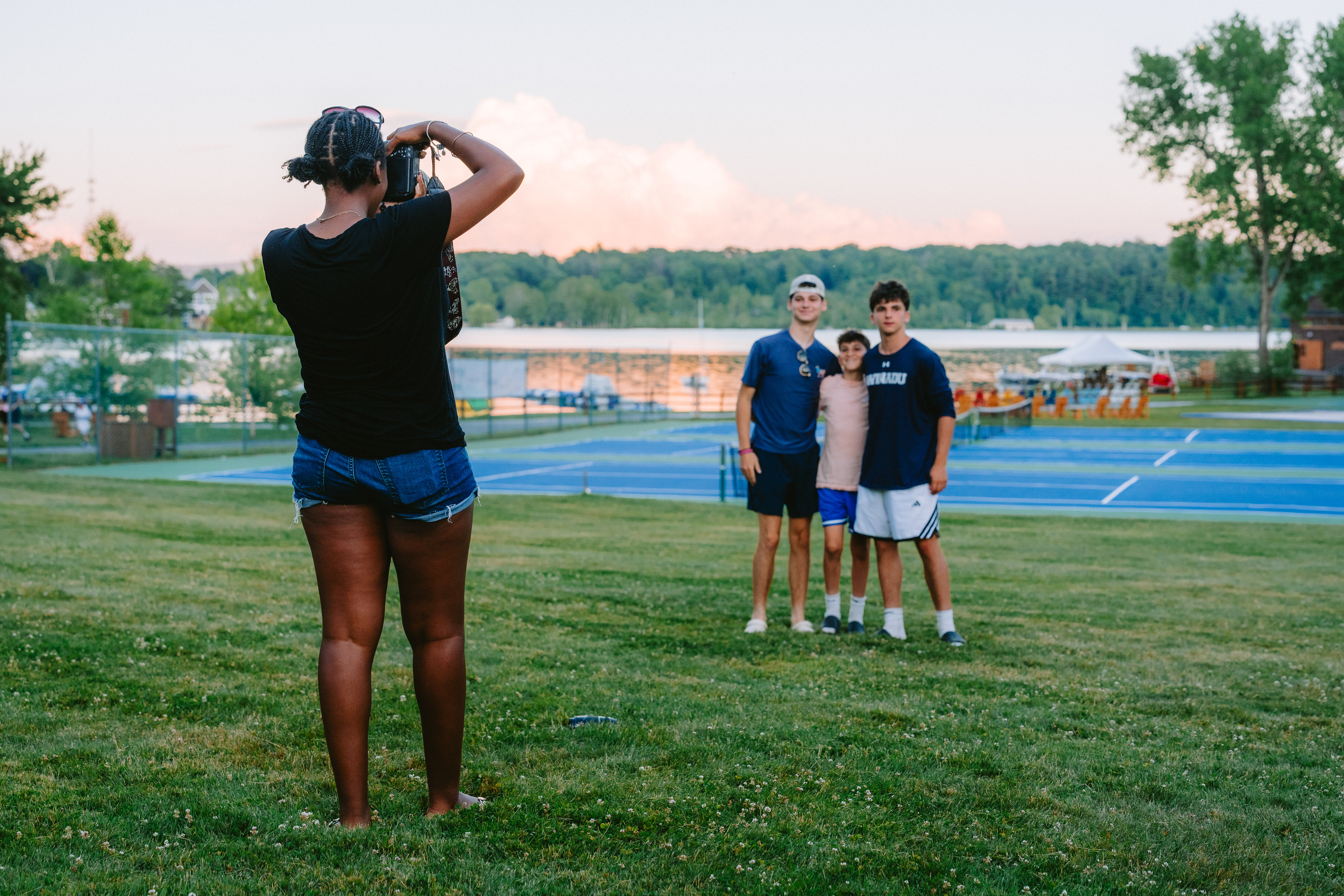 Camp Winadu photographer taking a photo of campers by the lake
