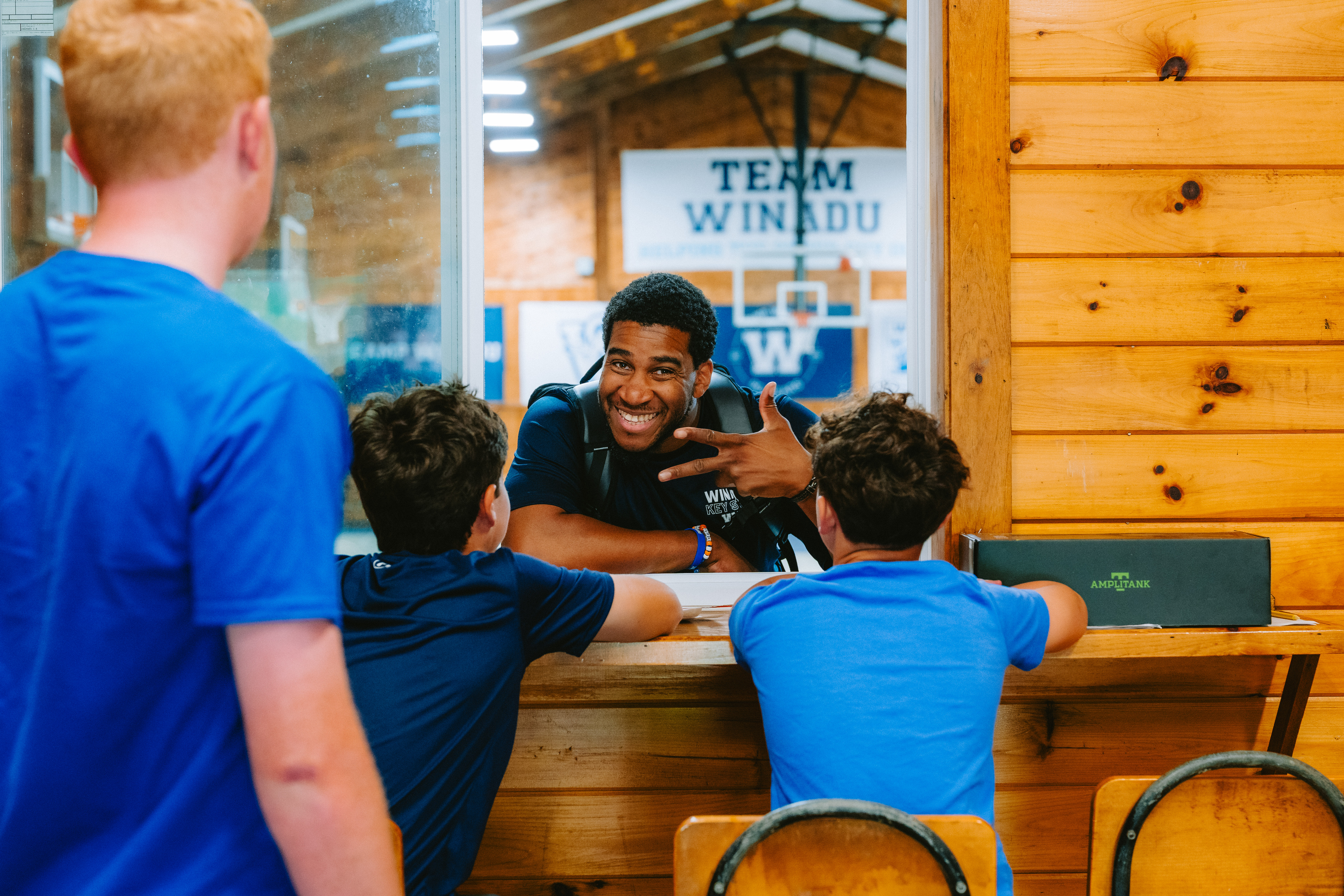 Camp Winadu counselor talking with campers