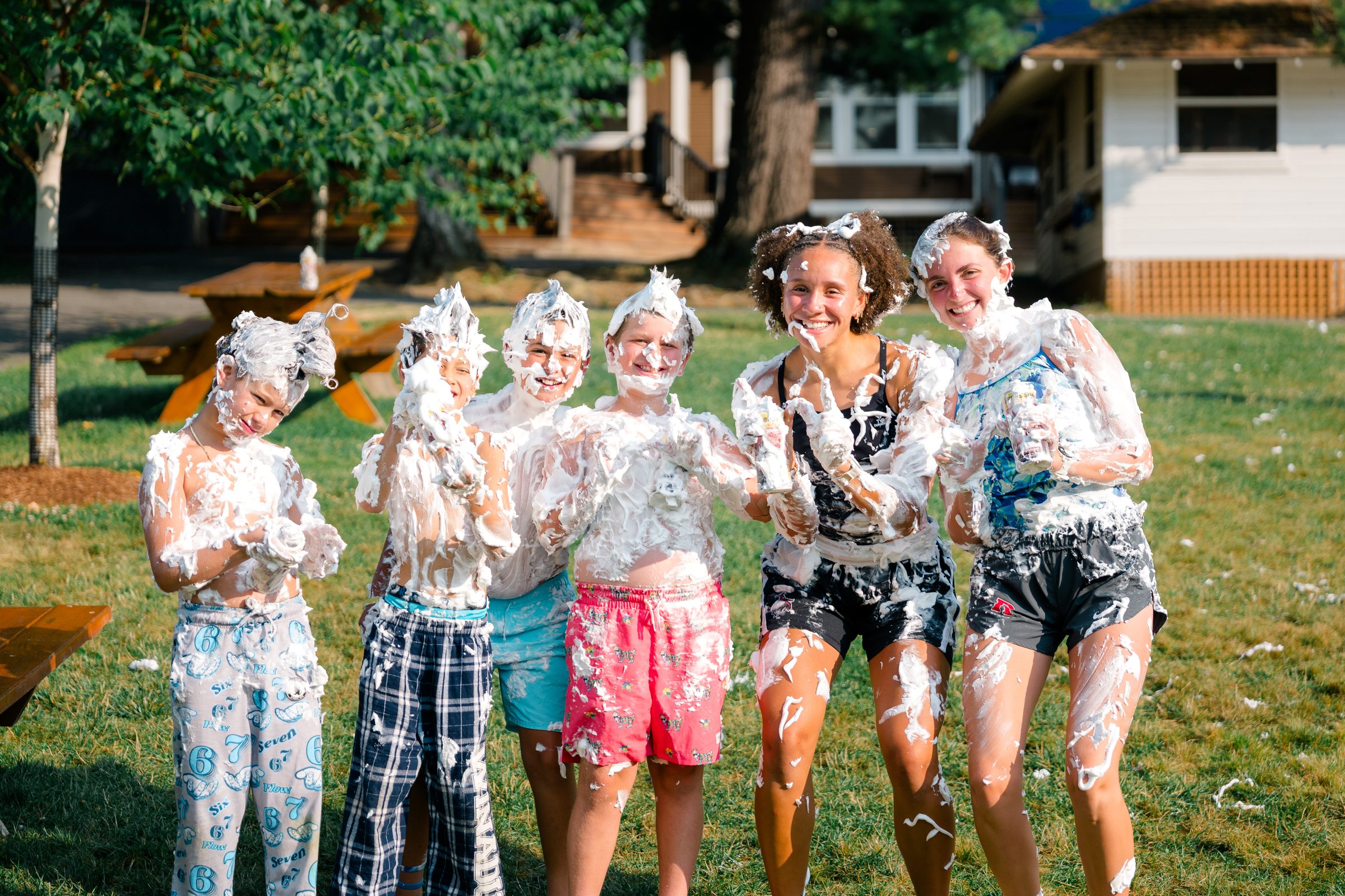 Camp Winadu staff and campers covered in shaving cream