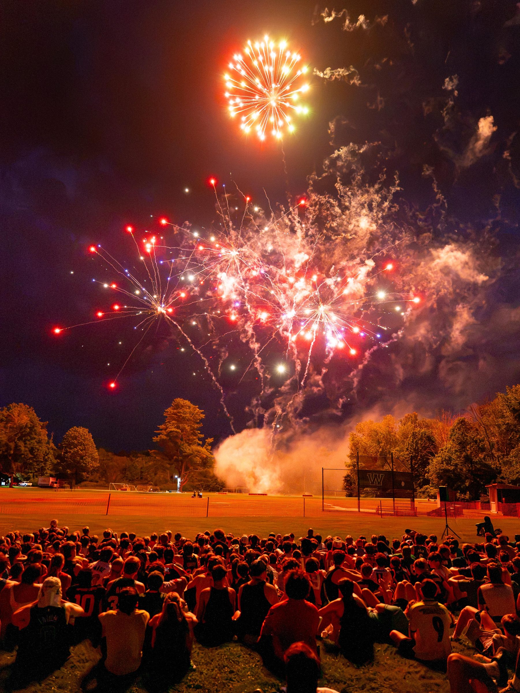 Fireworks over the whole camp on the field at night