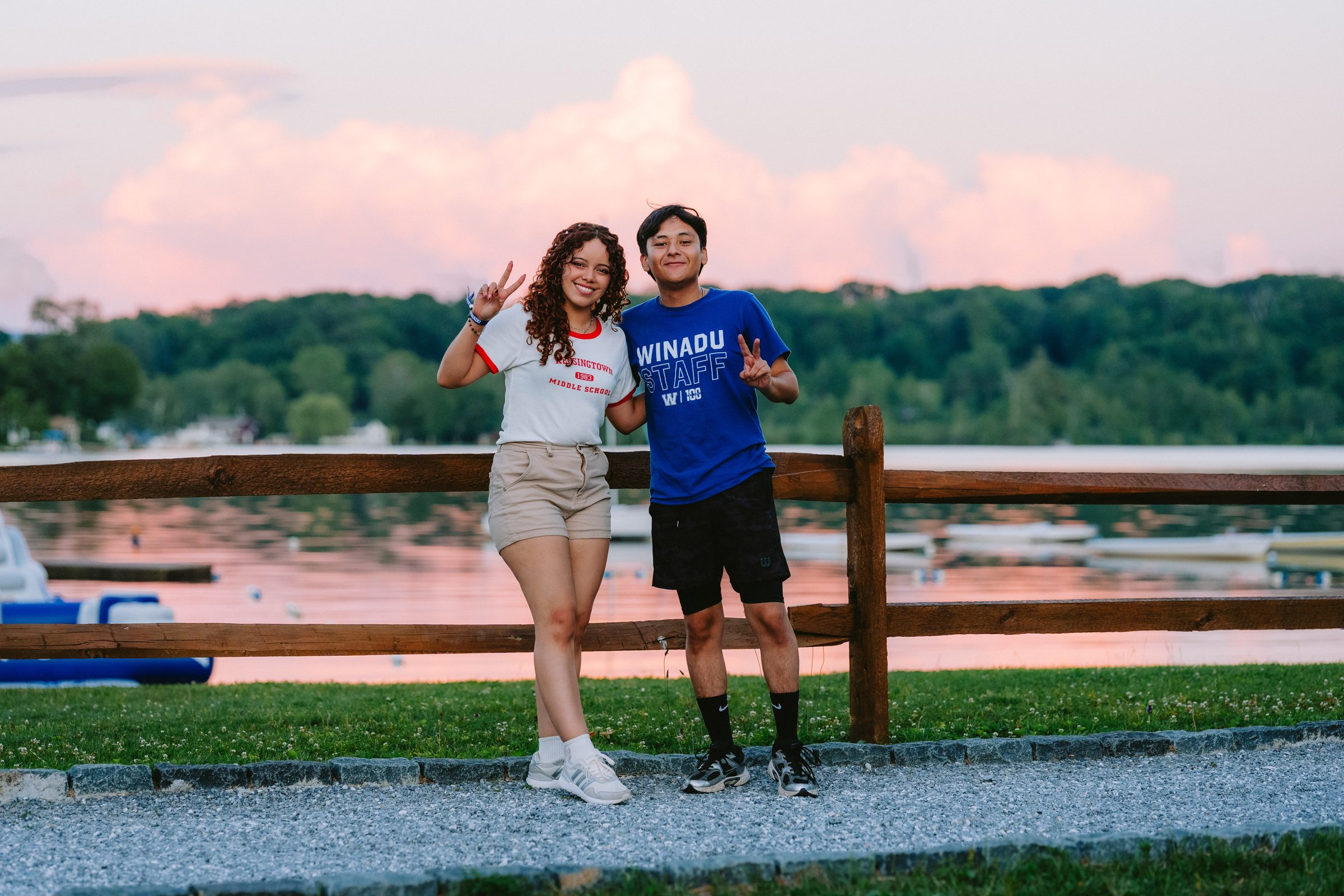 Camp Winadu support staff by the lake at sunset